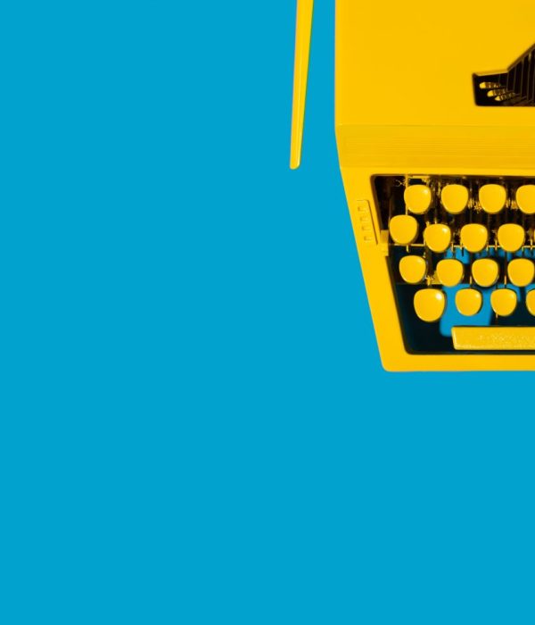 yellow-typewriter-against-a-bright-blue-background-2026-01-07-06-14-10-utc